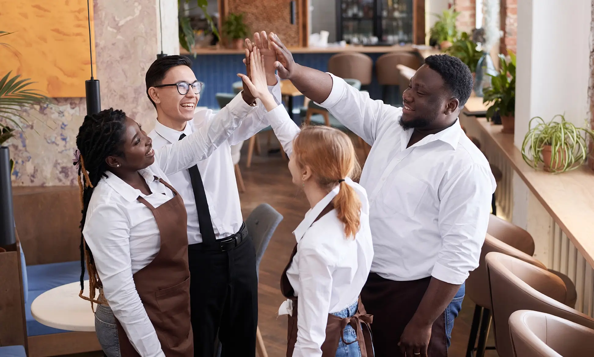 group of people shaking hands at work